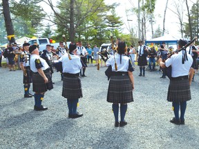 Photo by KEVIN McSHEFFREY/THE STANDARD
The OPP Pipe and Drum Band, which was on a tour celebrating its 50th anniversary, made a stop at the North Shore Rib Fest on Saturday. They delighted the crowd that attended the event with their playing of the bagpipes and drums.