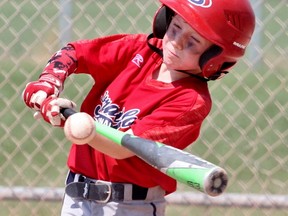 Cam Parsons connects with a pitch during the Jack Grasby Memorial Minor Mosquito Tournament championship Sunday afternoon. The Stratford Nationals defeated Essex 14-3. (Cory Smith/The Beacon Herald)