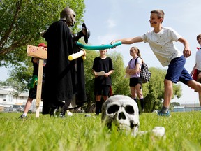 Our Lady of the Angels’ students battle an Orc (Paul Corrigan, Assistant Superintendent Elk Island Catholic Schools) during a mythic battle which was part of a practice exam for their Grade 8 Science final.