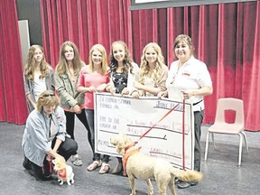 Five J.C. Charyks Grade 7 girls, Emma Moulton, Jade Pahl, Neely Antosh, Tatum McCuaig-Vredegoor, and Elizabeth King, raise money to help support the St. John Ambulance’s Therapy Dog program and its outreach in the community.