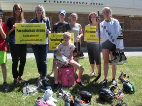 Londoners in Old South are rallying to save the ice pads at Farquharson arena, which they say is an integral part of the community. (L-R) James Colquhoun, Lisa Conley, Lisa Nelson, Ethan Saunders, Isabella Colquhoun, Heather Saunders, Lori-Ann Pizzolato and Keira Hurry all skate at the arena or help to run free community skating events. (Megan Stacey/Postmedia News)