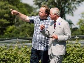 Postmedia file photo
Norman Hardie, pictured here giving Prince Charles a tour of his County winery last year, has had his membership in the Prince Edward County Winegrowers’ Association suspended. The suspension is part of the fallout the County winemaker has faced since allegations of sexual misconduct were reported earlier this week.