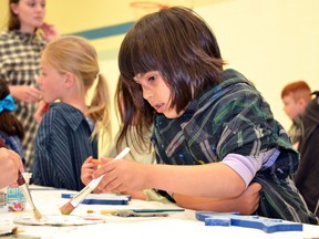 During the Upper Thames River Conservation Authority’s Stream of Dreams program at St. Aloysius School in Stratford Friday, senior kindergartener Dellia Voeco begins painting her “dreamfish.” (Galen Simmons/The Beacon Herald)