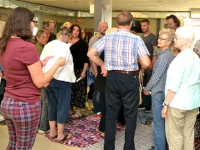 Lu Roberts, an Indigenous justice coordinator with the Southwestern Ontario Indigenous Justice Initiative, narrates the Indigenous blanket exercise at the Local Community Food Centre in Stratford Friday afternoon. (Galen Simmons/The Beacon Herald)