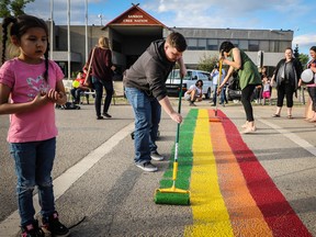 In honour of Pride Month, members and allies of the Maskwacis Two Spirit Society teamed up to paint a Pride flag in a crosswalk in front of Samson Cree Nation’s band office in Maskwacis last Wednesday. (Sarah O. Swenson/Wetaskiwin Times)