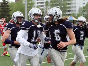 Sudbury Spartans players Riley Roy (17) and Konnor Gillis (6) celebrate Roy's interception against the Steel City Patriots during Northern Football Conference action at James Jerome Sports Complex in Sudbury on Saturday, May 26, 2018. Ben Leeson/The Sudbury Star/Postmedia Network