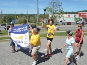 Photo by KEVIN McSHEFFREY/THE STANDARD
The 36th Ontario Law Enforcement Torch Run for Special Olympics strolled through Elliot Lake Friday afternoon, before heading to Blind River for a torch run there at 5 p.m. A number of Elliot Lake Special Olympics participants carried the torch from the intersection of Highway 108 and Stone Ridge Golf Course road, through the city to the OPP detachment in Elliot Lake.