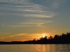 The sun sets over Panache Lake, with Morin Island in the foreground. (Jim Moodie/Sudbury Star)