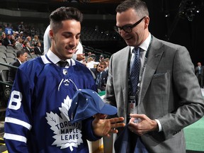 DALLAS, TX - JUNE 23:  Sean Durzi reacts after being selected 52nd overall by the Toronto Maple Leafs during the 2018 NHL Draft at American Airlines Center on June 23, 2018 in Dallas, Texas.  (Photo by Bruce Bennett/Getty Images)