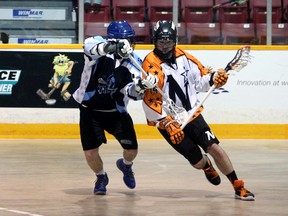 Patrick Saunders wheels around Oakville Titans defender Jake Stroscher in the second period of the NorthStars 14-10 win at the Bayshore on Saturday night. Greg Cowan/The Sun Times.