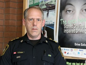 Stratford police acting Chief Gerry Foster stands next to a poster at the police headquarters that reads "Stoned driving is impaired driving." JONATHAN JUHA/THE BEACON HERALD/POSTMEDIA NETWORK