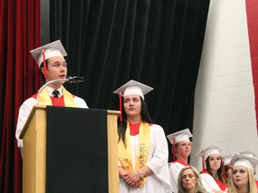 Valedictorians Matthew Favreau (left) and Shelby Leroux deliver their speeches to the audience. KATHLEEN CHARLEBOIS/DAILY MINER AND NEWS