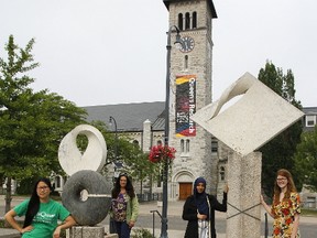 Math Quest, a national all-girls math camp at Queen’s University, is open for registration and this year the diversity of instructors is very broad, including Hope Yen, from left, camp director Siobhain Broekhoven, Razan Alnakhli and Maddie Baker, seen here by the Five Sculptures on Topological Themes outside Jeffery Hall at Queen’s University in Kingston. (Julia McKay/The Whig-Standard/Postmedia Network)