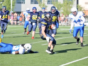 Gordon Anderson/Daily Herald-Tribune
Brannon Edgar of the Grande Prairie Drillers picks his way through the teeth of the St. Albert Stars defence on the way for a big run. The Drillers dropped a 25-0 decision to the Stars in Alberta Football League action at CKC Field on Saturday night.