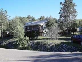 The owners of this home at 2115 South Bay Road are trying to resolve a land issue with Laurentian University. (Gino Donato/Sudbury Star)