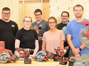 From left, Lockerby students Garrett Wisniewski, Dana Simeoni, Christian Rainville, Veronica Dynes, Brayden Martin and Colby Lindroos display the tools they received in the Milwaukee prize pack. (Photo supplied)