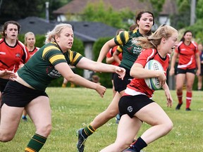 Belleville Bulldogs ballcarrier Annabelle Clements evades a Cobourg Saxons defender during TRU senior women's rugby action Saturday at Cobourg. (Chris Malette for The Intelligencer)
