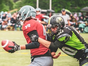 Quinte Skyhawks linebacker Riley St. Pierre grabs a York Lions ballcarrier during OFC East Division action Saturday at MAS 2. (W.J. Smith Photography)