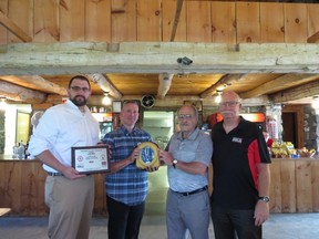 On June 23, the Dave Mounsey Memorial Fund donated its 93rd defibrillator to Woodlands Golf Course in memory of local fallen firefighter John Miller. From left to right: OPP Constable Adam Seltzer, Patrick Armstrong of the Dave Mounsey Memorial Fund, owner of Woodlands Golf Course Gord Lobb, Wayne Sommers of Crimestoppers. (Contributed photo)
