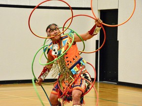 Dallas Arcand performs with 13 plastic hoops at Sangudo Community School on June 18. (Taryn Brandell | Mayerthorpe Freelancer)