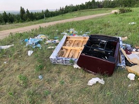 An illegal dumping site in Woodlands County (John Burrows | Facebook).