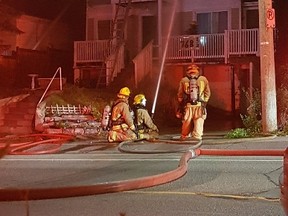 Photo Jacob Aalders
Firefighters knock down a blaze in an apartment building on Montreal Street early in the morning on Monday, June 25.