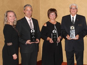 The Thackerays were recognized for long service in the funeral industry. The Alberta Funeral Association recognized Jeff for 25 years, Elda for 40 and Don for 50, during their annual convention. Seen here from left to right: Teresa Thackeray, Jeff, Elda, and Don.