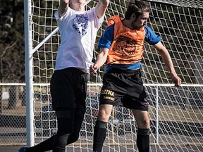 Goalkeeper Connor Vande Weghe, left, leaps to catch a ball during training with the Thunder Bay Chill soccer team. Photo supplied