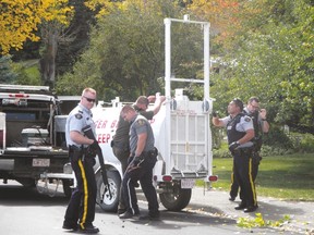 A bear is “taken into custody” following a short standoff and tranquilization in the front yard of a residence on Bev McLaughlin Drive on Sept. 20, 2016.