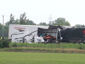 OPP direct traffic that was detoured off the eastbound Highway 401at the Essex County Road 42 off-ramp just outside of Tilbury on June 22. Ellwood Shreve/Postmedia Network