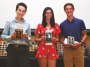 Joel Wouters, left, was awarded junior high male sports person of the year, Taylor Ellis, senior high female sports person, and Jan Lourens senior high male sports person. Sydney Carey was awarded junior high female sportsperson of the year.