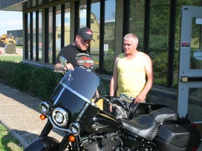 Peter Sellers of the Harley Davidson program at GPRC Fairview went over all the features of the new Harley Davidson from the GPRC Harley raffle with winner Paul Sowinski.