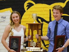 Jalen Payson (left)and Scott Chisholm (right) hold up their Tollestrup Memorial Awards they were given at Banff Community High School on Tuesday June 19, 2018. The award is given to two grade 12 students that exemplify excellence in athletics, academics and leadership. Deanna Montalvo/ Crag & Canyon.