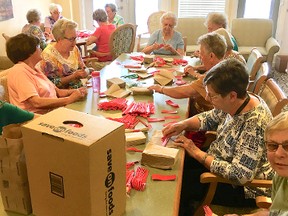 Bedford Village residents volunteer their time to package thousands of cutlery sets in preparation for the pancake breakfast to be held on the morning of Canada Day in the agora of the Strathcona County Community Centre.

Photo Supplied