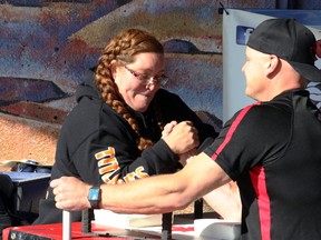 Maria Peterson of Wanham, three-time national arm wrestling champion in the Ladies Super Heavy Weight category, tests her mettle in a friendly match against Grande Prairie's Joe Fox, Gold champion in the Heavy Weight right-hand category at the Northern Twistmasters tournament at Muskoseepi Park. Peterson is in Laval, Que., this weekend for the Canadian armwrestling championships.