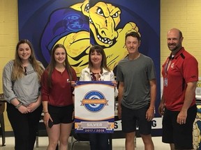 Bishop Alexander Carter students Allison Kenyon, left, Darla Leroux, Parker Savard, second right, and school principal Cassandra MacGregor, and program leader JG Larocque display the silver certification by the Ontario Physical and Health Education Association. Supplied photo