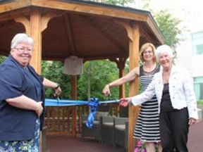 Sister Bonnie MacLellan, left, General Superior, Sisters of St. Joseph of Sault Ste. Marie, Jo-Anne Palkovits, president and CEO of St. Joseph’s Health Centre, and Jeanne Warwick-Conroy take part in a re-naming ceremony of the SJCCC Healing Garden to the Jeanne Warwick-Conroy Healing Garden. Supplied photo