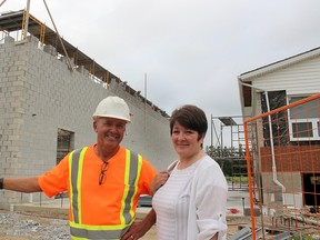 Construction is progressing on a 12,900-square-foot addition to the EbenEzer Christian School in Chatham that will include a new gymnasium, kitchen, change rooms and storage space. Paul Hoekstra, project foreman, and Deb DeBoer, school board member, check out the construction. (Ellwood Shreve/Postmedia Network)