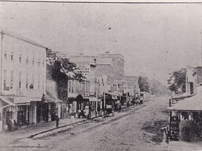 King Street in the mid 1860s, looking west from Fifth Street. The McKeough Block is the building with the words paint, oils. etc. painted on the east side of the upper floors. (John Rhodes photo)