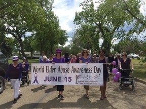 Many Dr. Turner Lodge seniors, local politicians, supportive organizations and nonprofits and members of the public wore purple during a brief walk on 95 Street in support of World Elder Abuse Awareness Day on June 15.