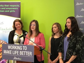 Stephanie McLean (second from left), former minister of Status of Women in Alberta, announces a new pilot program to be offered in Sherwood Park that will result in sexual violence survivors receiving free legal advise. Survivor Elzabeth Halprin (second from right) said she wishes the service had been available six years ago, when she was attacked.