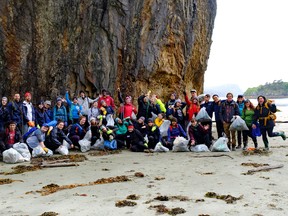 The cleanup crew team at Lepas Bay, Graham Island in Haida Gwaii, B.C. pose with some of the garbage they collected on May 22. (SUBMITTED PHOTO)