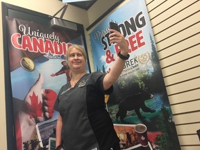 In celebration of Canada Day, Yurek Pharmacy is holding a “selfie” challenge. Participants are asked to go to their 519 Talbot St. location, take a “selfie” in front of the uniquely Canadian banners and tag the pharmacy on social media. When they get 25 pictures, Yurek’s will donate $250 to The Grace Café. Pharmacy employee Stephanie Ymansky tests out her “selfie” skills in front of the banner. (Laura Broadley/Times-Journal)