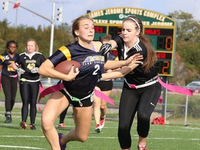 High school flag football kicked off with a game between the Notre Dame Alouettes and the Lively Hawks in Sudbury, Ont. on Monday September 18, 2017. Kendra Rouleau of the Lively Hawks attempts to tag out Marie-Michelle Croteau of the Notre Dame Alouettes.Gino Donato/Sudbury Star/Postmedia Network