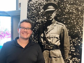 Lake of the Woods Museum educator Braden Murray with a life-size photo of Ashton Thomas Fife, a local recruiting officer during the First World War. He also owned the Fife Hardwear Company, a name still visible in the Kenora skyline.
RYAN STELTER/DAILY MINER AND NEWS