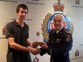 Dylan Depooter (left) was recognized June 26 by the Chatham-Kent police services board and Chief Gary Conn for his actions after an April 20 collision. A vehicle was located by Depooter submerged in water upside down on Border Road just north of Swan Line in a drainage ditch. Depooter, along with the first officers on scene, constables Ken Muir, Chris Robb and Jodie Foster attempted to rescue the occupants of the vehicle. The male passenger was successfully rescued but the driver died in hospital. The officers will be recognized at a formal CKPS awards banquet in the fall. Trevor Terfloth/Postmedia Network