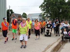 Participants headed out after a warm-up at the Wiarton Arena and Community Centre, raising close to $30,000 for those with ALS and supporting those struggling with the disease at the ALS Walk in Wiarton, June 23. Photo by Zoe Kessler/Wiarton Echo