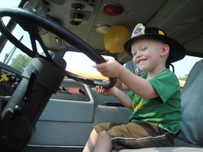 Evan Leversage takes the wheel at the inaugural Evan’s Touch the Truck event in St. Marys. (Postmedia file photo)