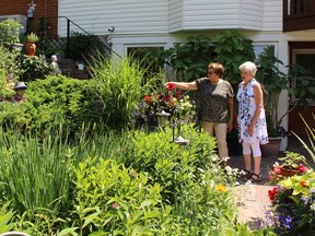 Marija Kelemen, left, shows Stratford and District Horticultural Society garden tour chairperson Marg O’Reilly her garden on Friday, June 29, 2018 in Stratford, Ont. (Terry Bridge/Stratford Beacon Herald)