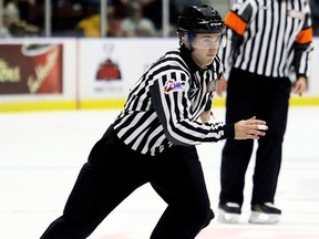 Linesman Mitch Dunning officiates an Ontario Hockey League game between the Kitchener Rangers and Sarnia Sting at Progressive Auto Sales Arena in Sarnia, Ont., on Saturday, Sept. 23, 2017. (MARK MALONE/Chatham Daily News/Postmedia Network)